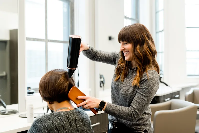 A hairdresser with a client